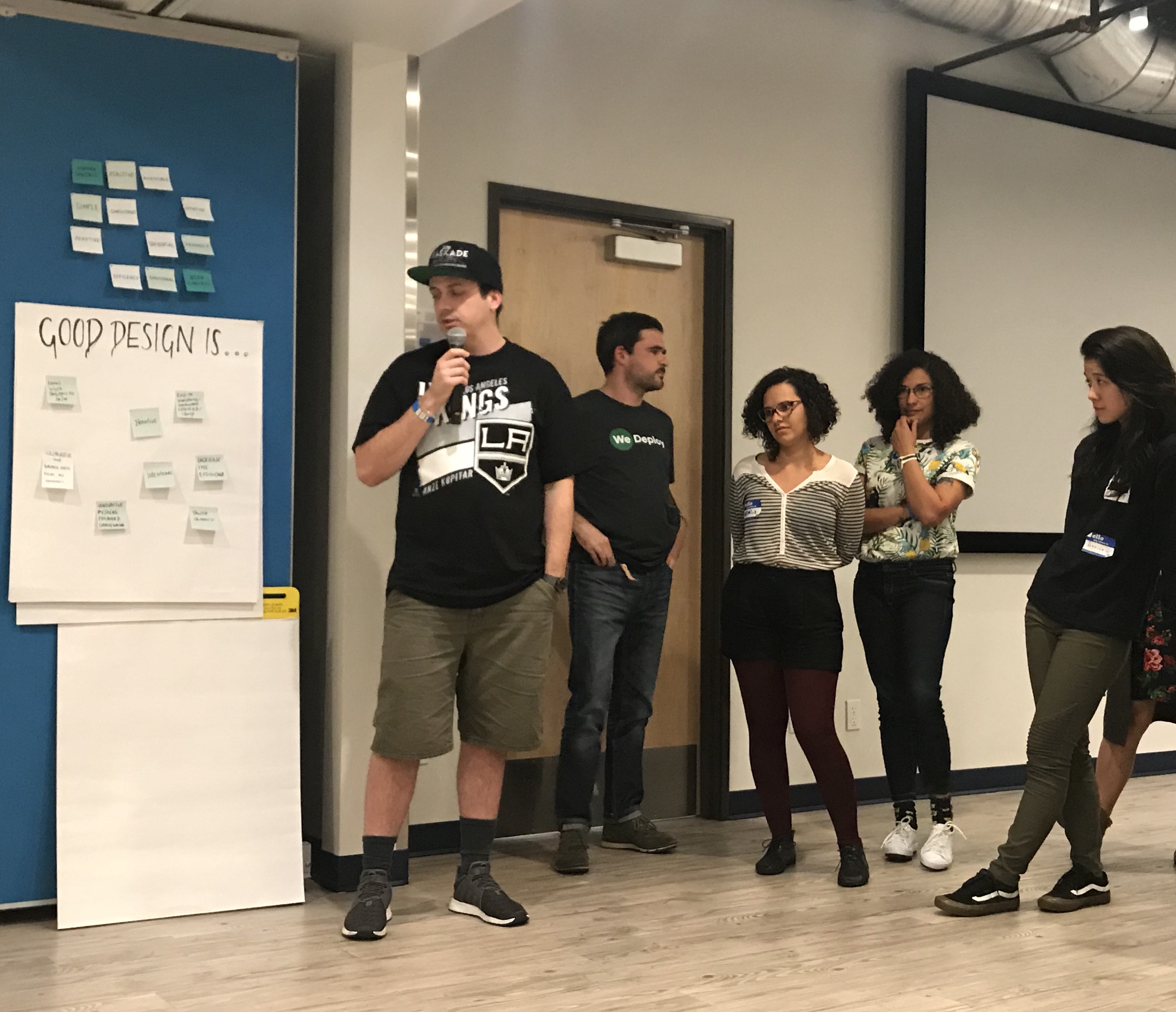 PJ sharing one group's ideas during the Principles exercise